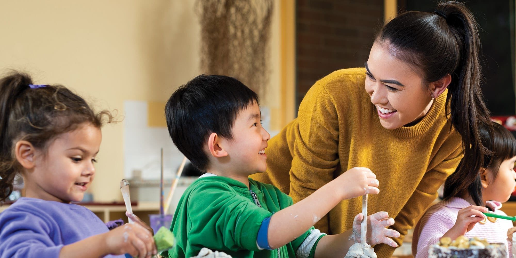 Female education student teaching primary school students