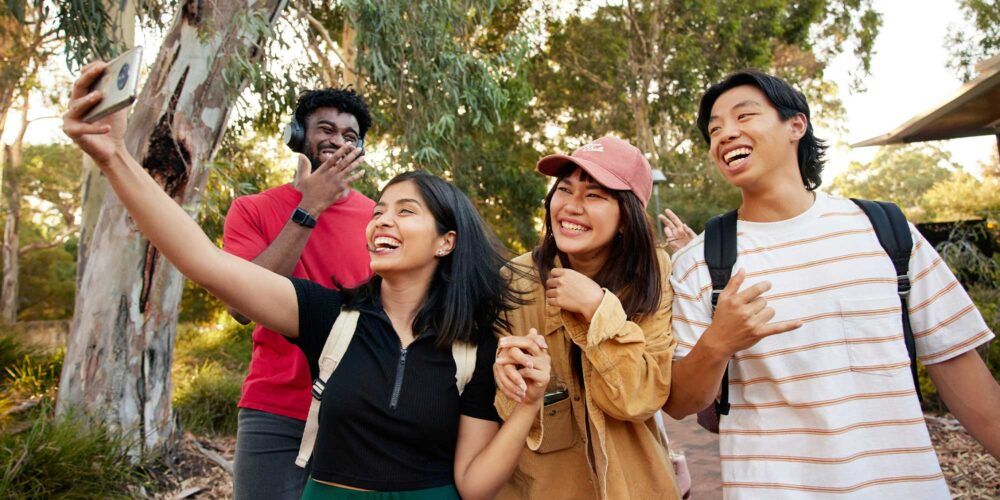 A group of students walking on the Curtin campus