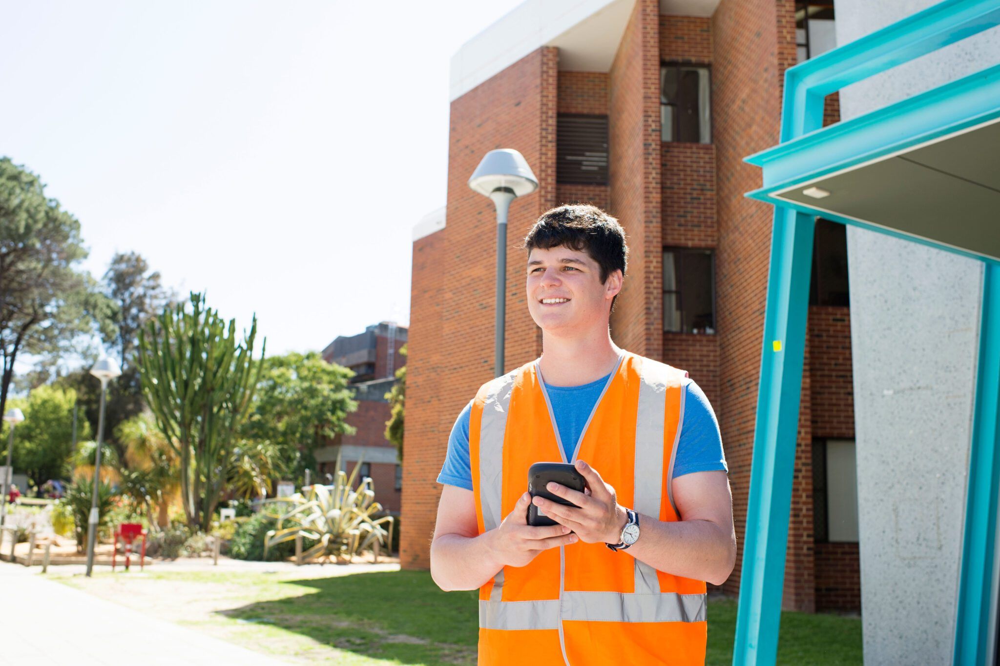 student wearing a orange vest