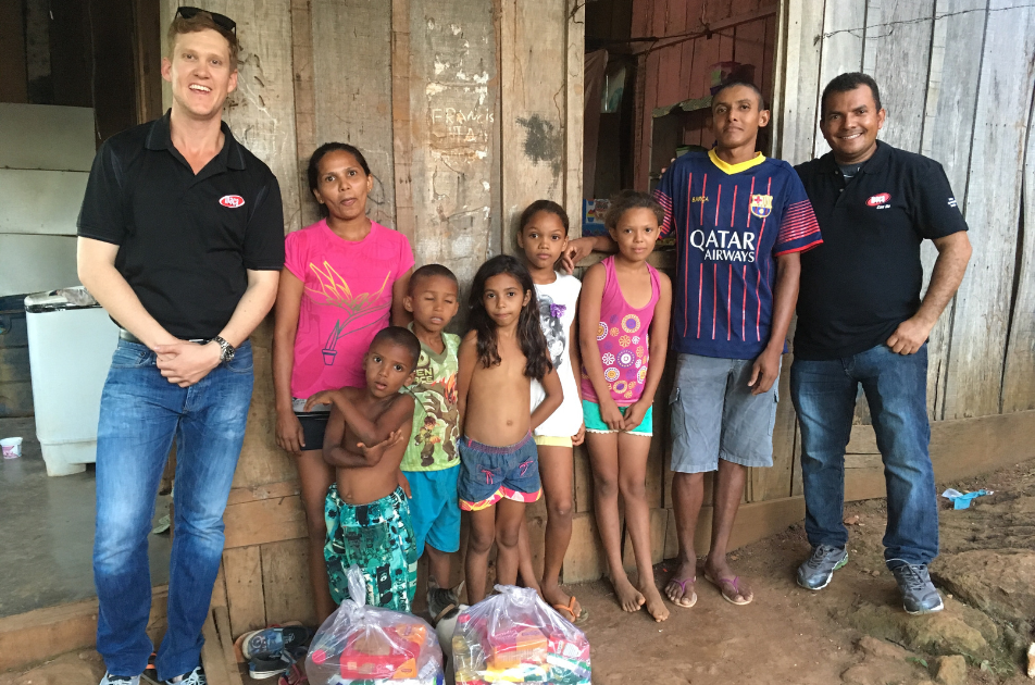 Josh with a group of children