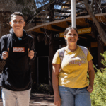 Two students standing in front of the Centre for Aboriginal Studies building.