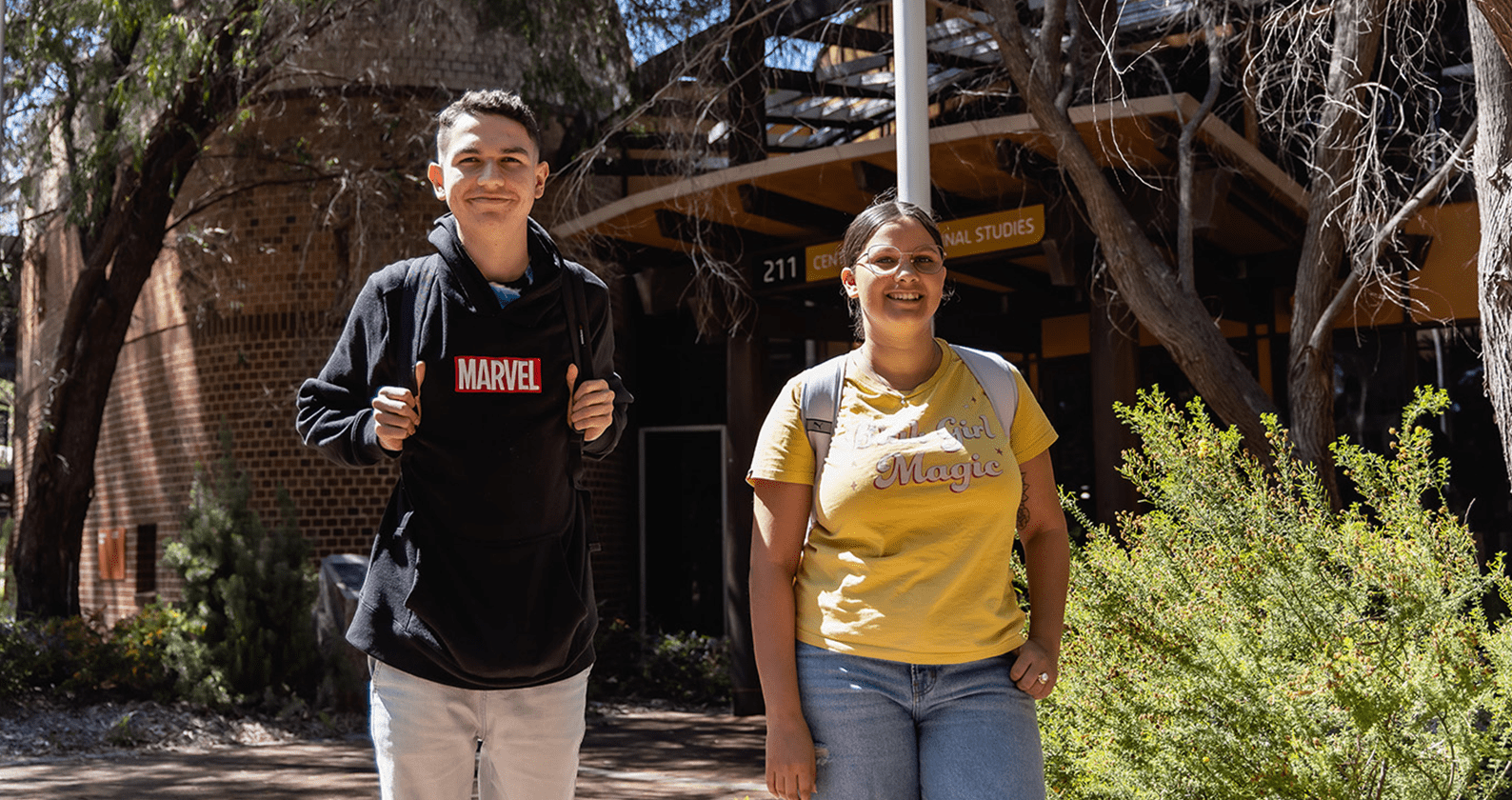 Two students standing in front of the Centre for Aboriginal Studies building.