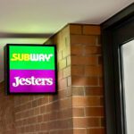 Jesters & Subway sign on campus.