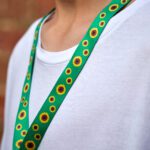 Person with sunflower lanyard