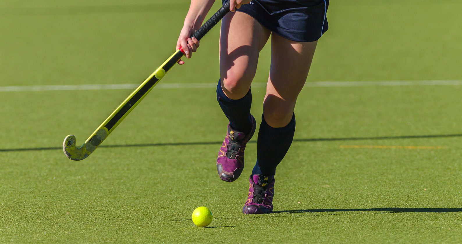 A hockey field with a player.