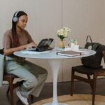 A student studying at home on her laptop.