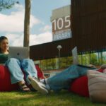 Two female students sitting on beanbags and working on laptops at the Curtin Bentley campus.