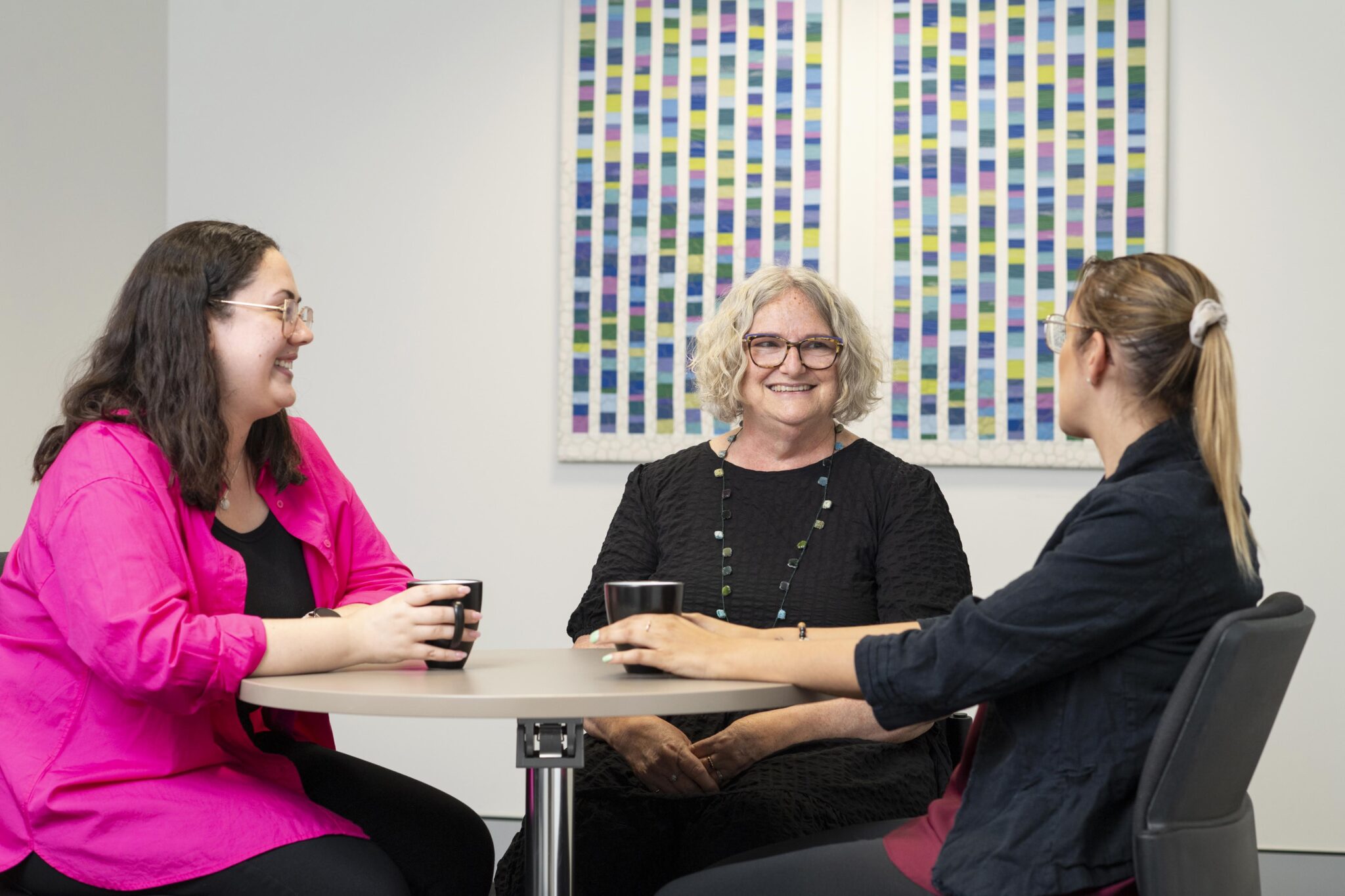 Three female social workers chatting