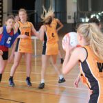 A photo of the Curtin Carnaby's playing netball in Inter-university sport.