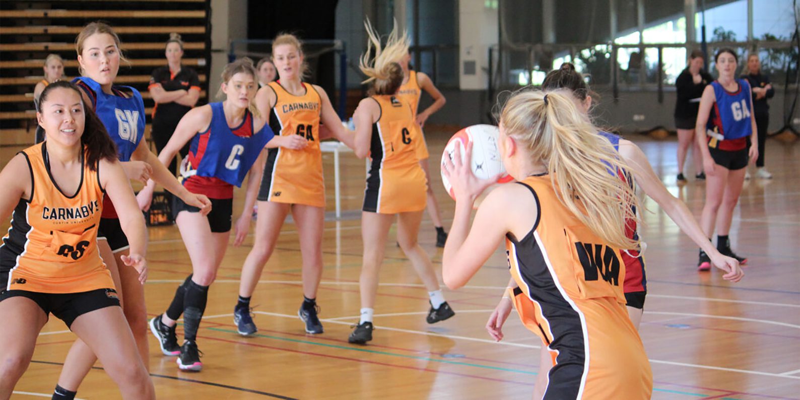 A photo of the Curtin Carnaby's playing netball in Inter-university sport.