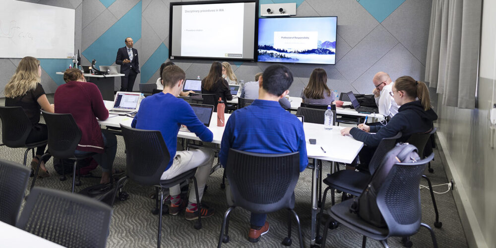 Class of students looking at presenter