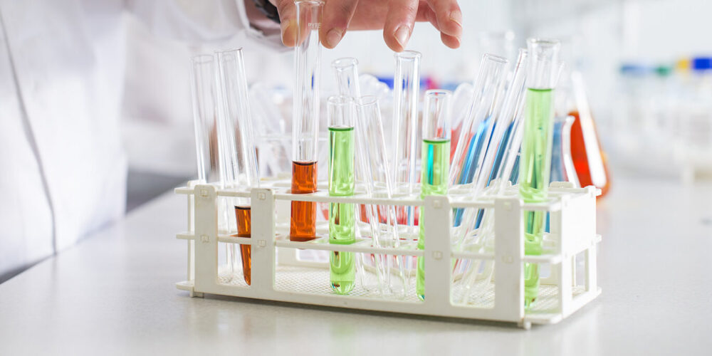 Rack of colourful test tubes