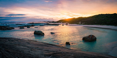 A beach in Denmark at sunset.