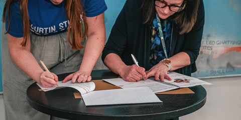 The VC and Guild President signing the Agreement.