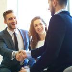 Business people shaking hands, finishing up a meeting