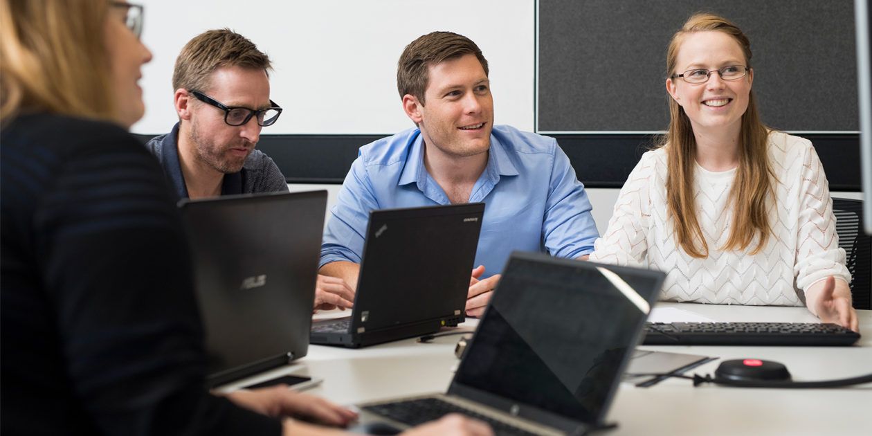 Four students sitting a table