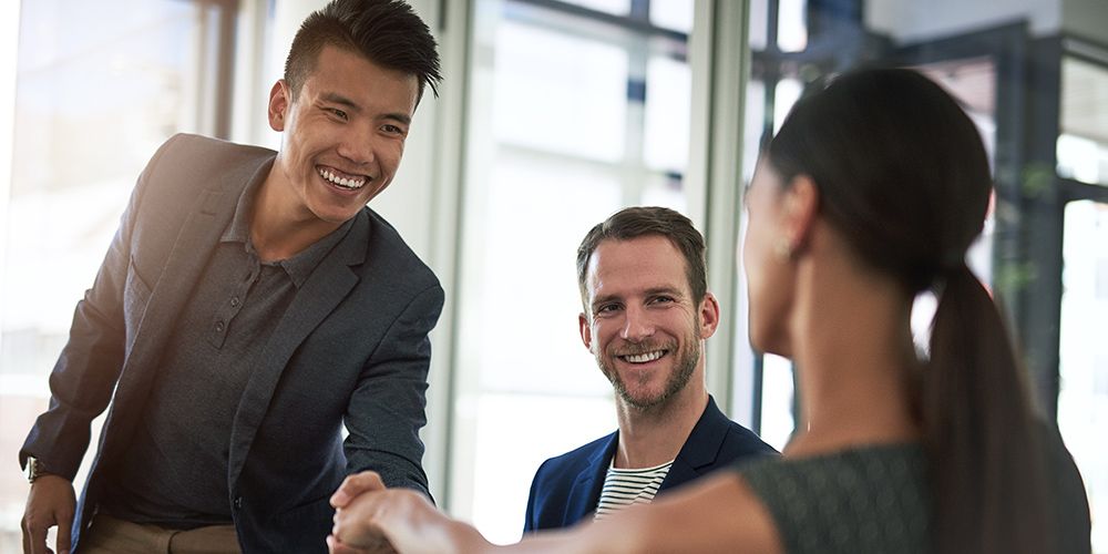 Shot of businesspeople shaking hands in an office