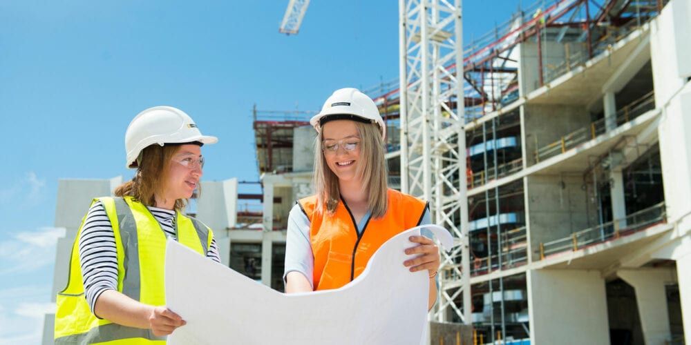 Civil engineering students inspecting construction plans at the Curtin Medical School