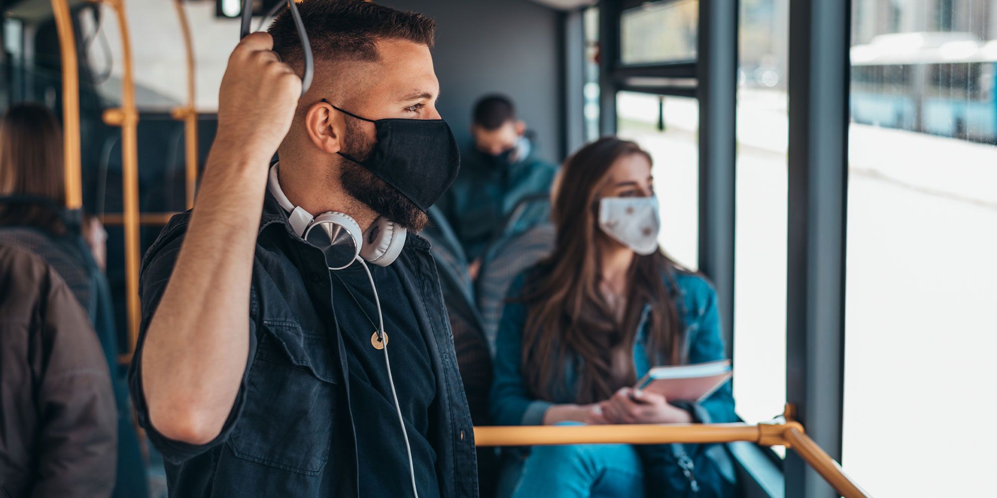 People on public transport wearing facemasks