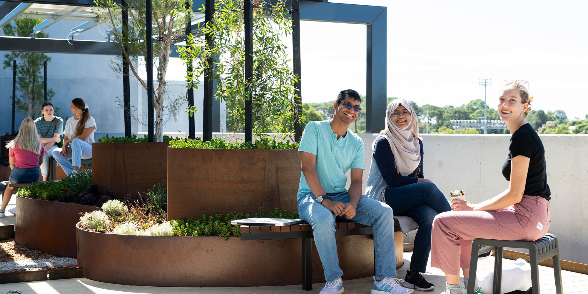 Students meeting at St Catherines rooftop garden