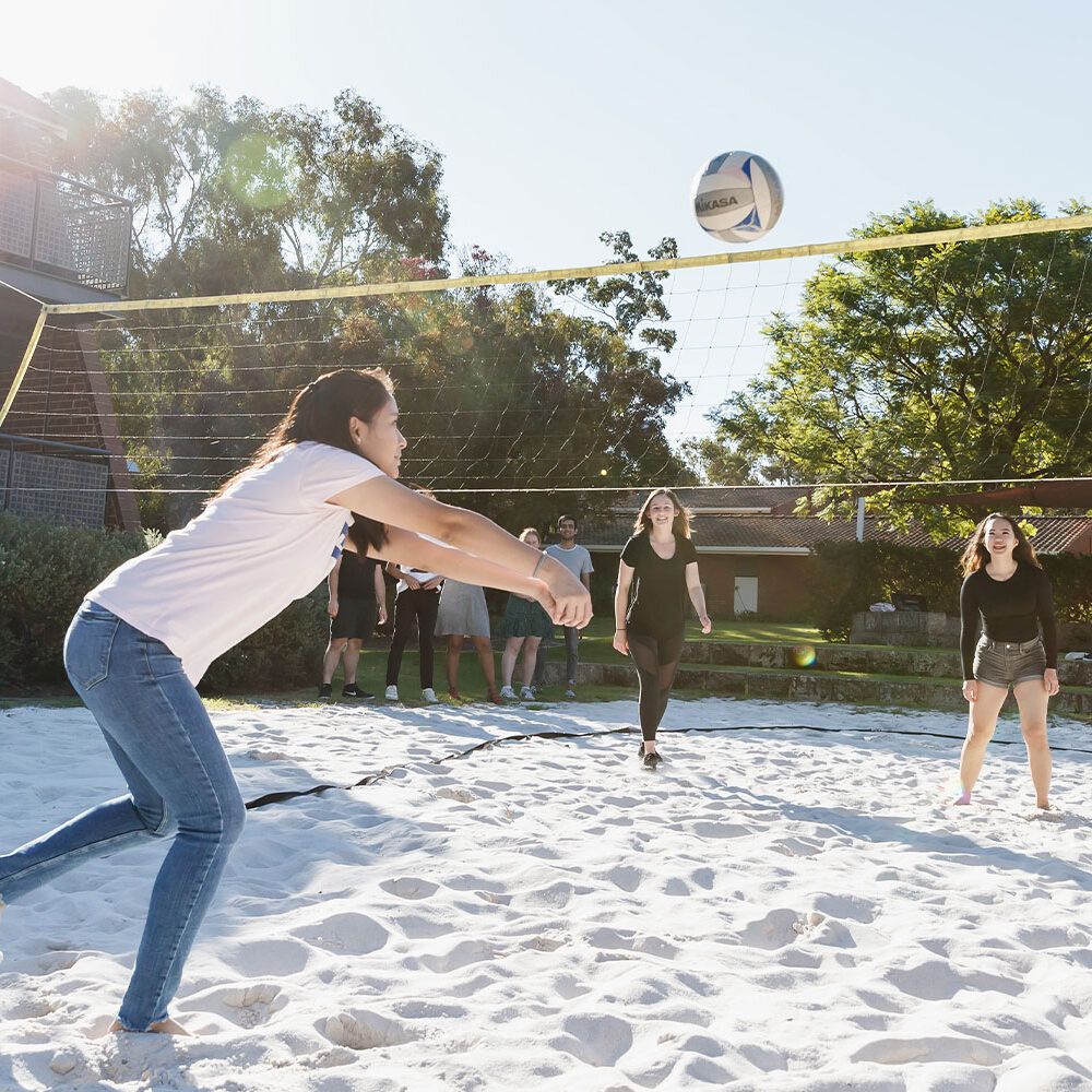 female students playing volleyball