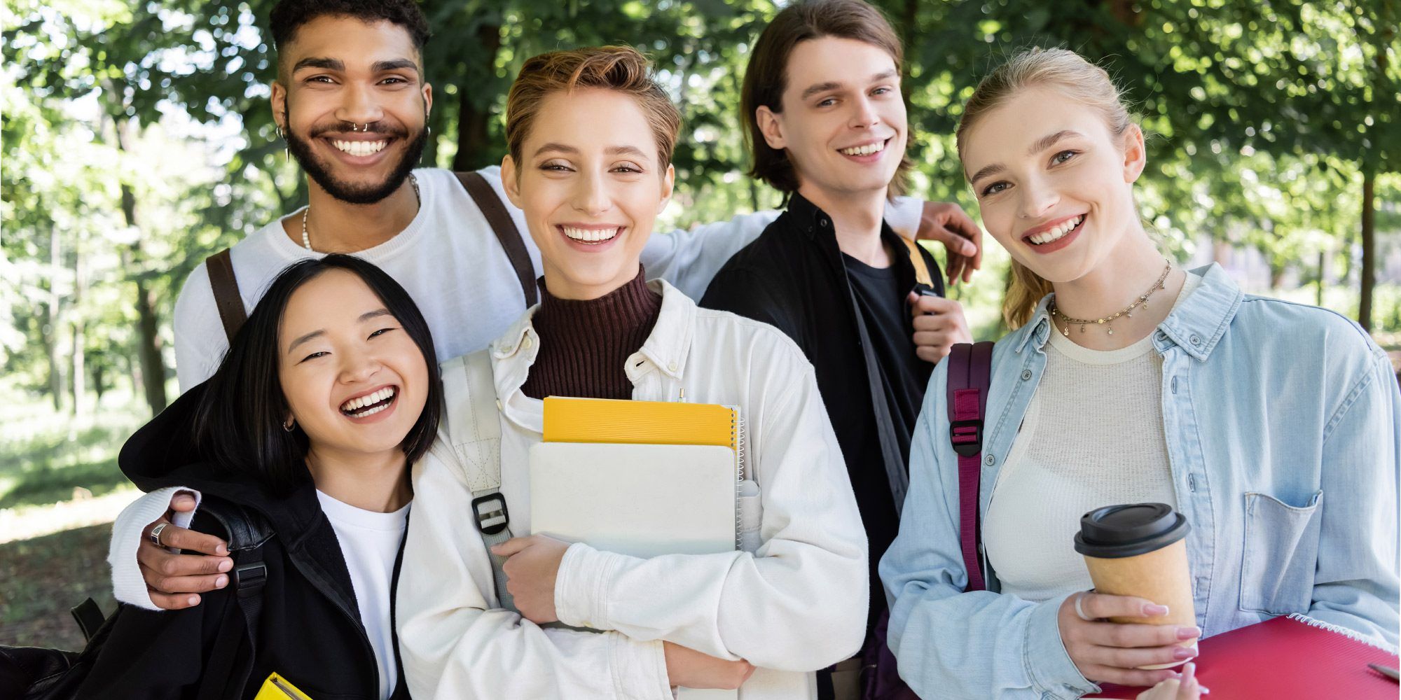 Group of five students smiling