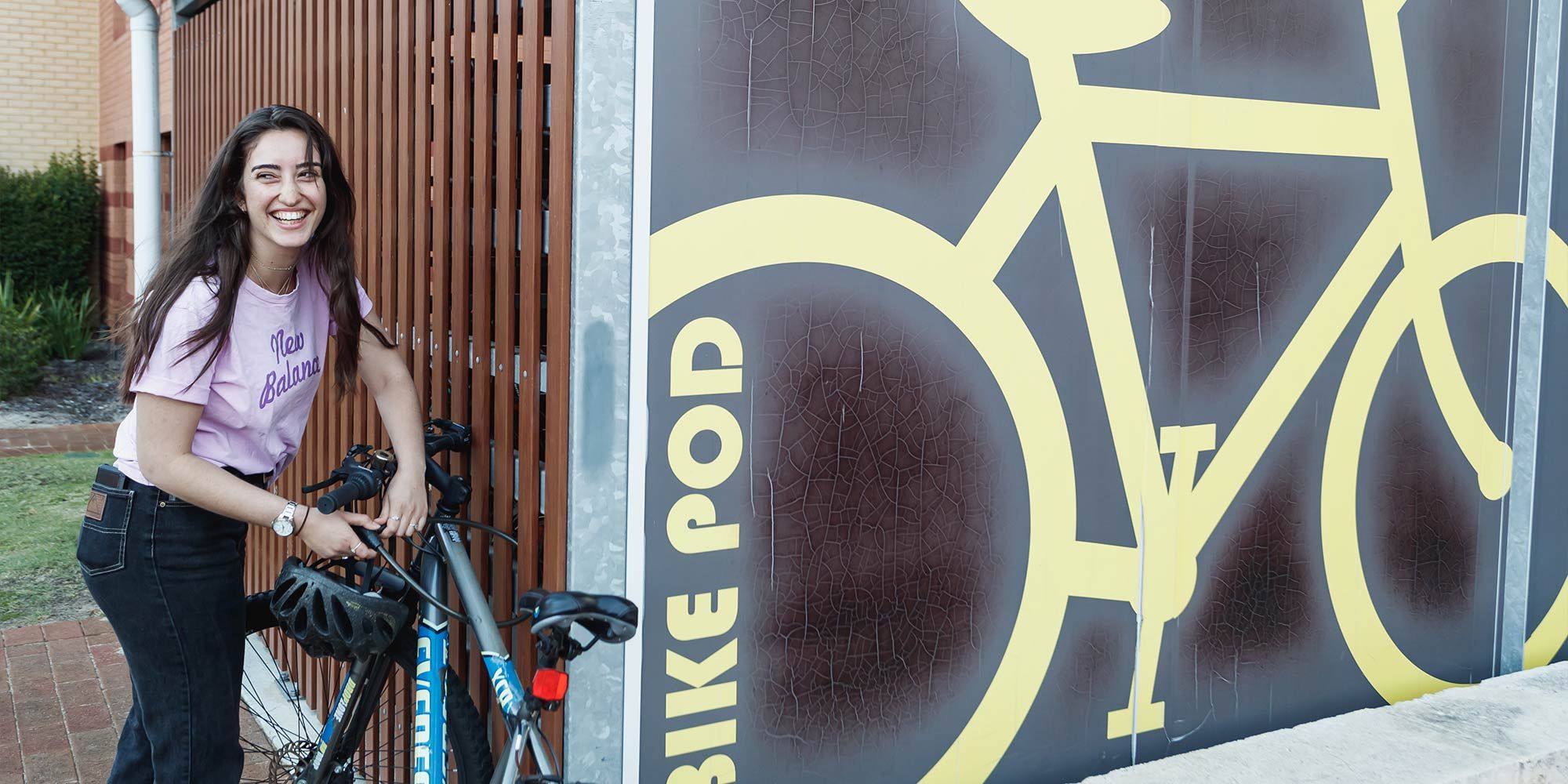 Student using bike pod