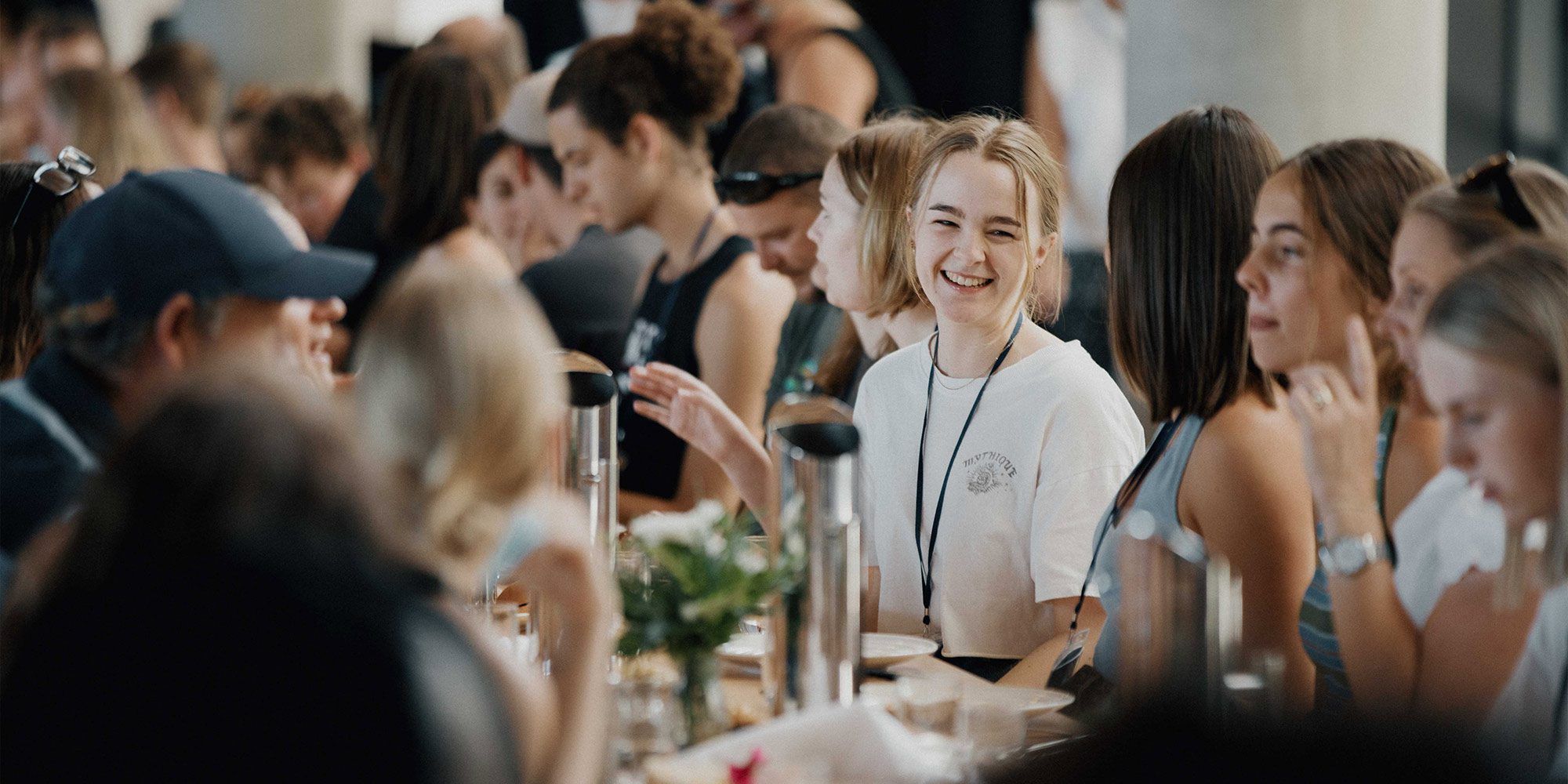 Smiling students at Saint Catherine's College dining hall