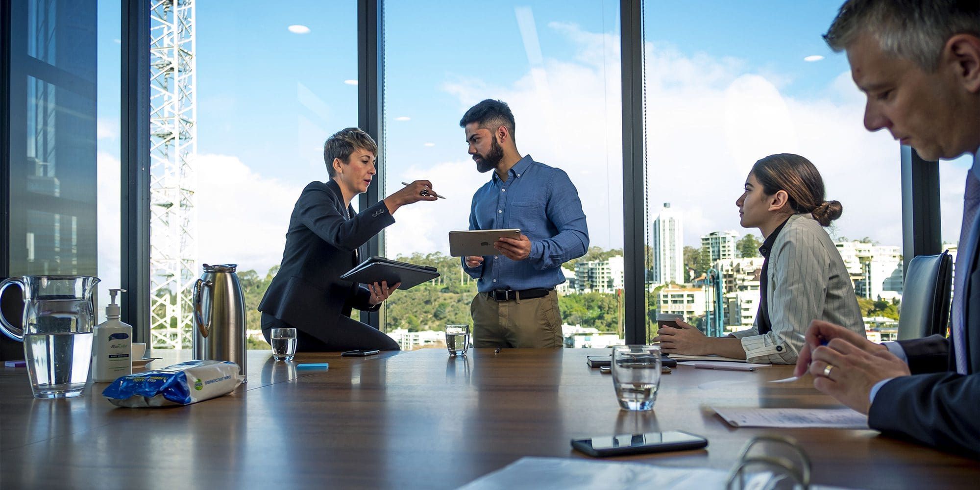 Team of four business people in meeting