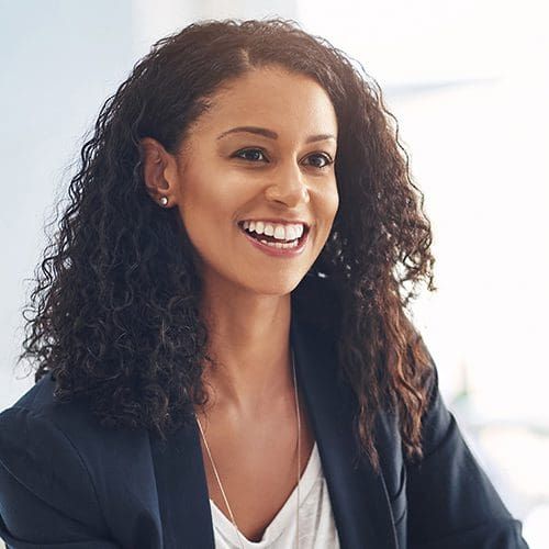 Shot of two young women having a conversation in a modern office