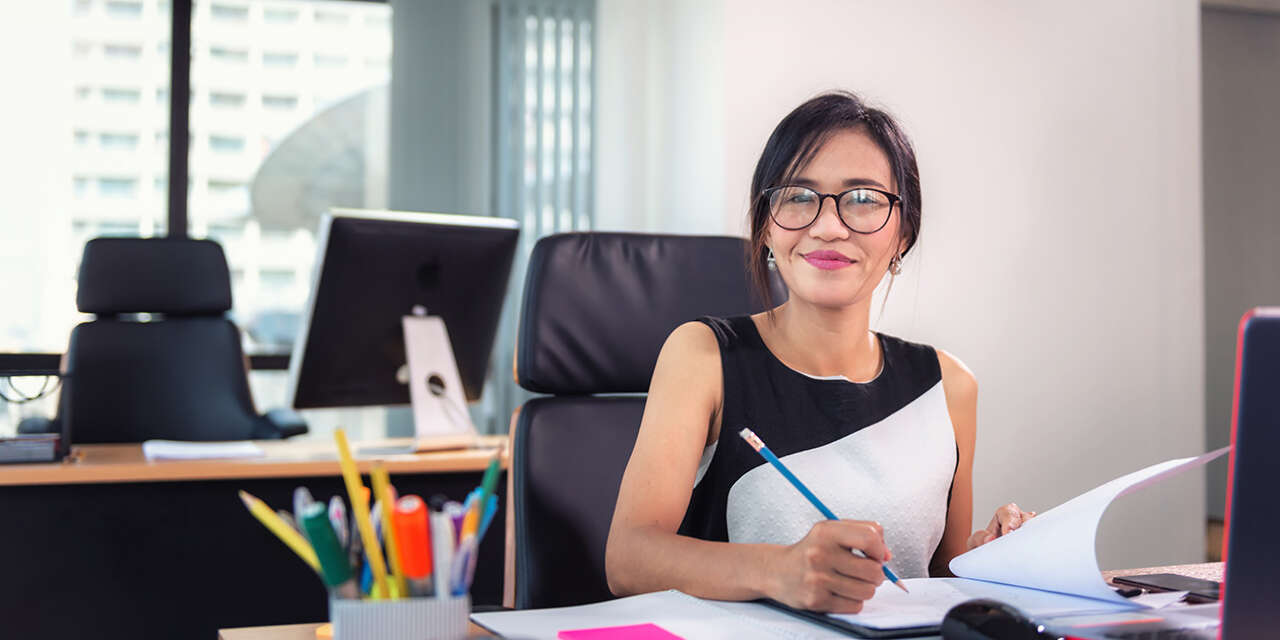 Business woman writing notes