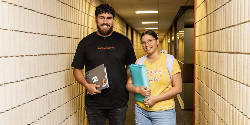 Students facing camera smiling